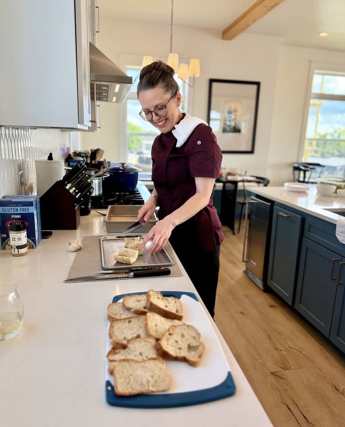 Chef Kay preparing food in a bright modern kitchen